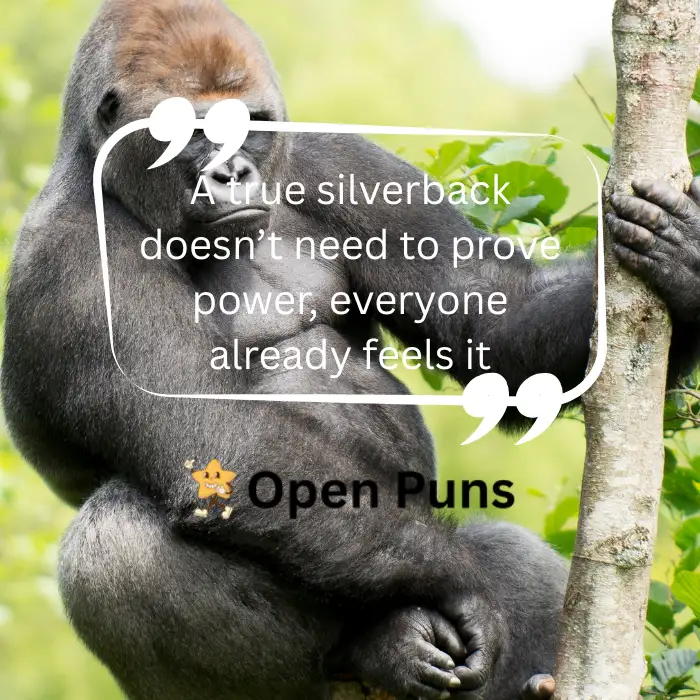 A close-up shot of a silverback gorilla perched comfortably in a tree branch against a soft green background. The image features a quote overlay stating, "A true silverback doesn’t need to prove power, everyone already feels it," with an Open Puns watermark.